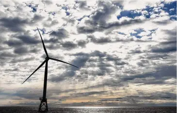  ?? ?? A Block Island Wind Farm turbine operates on Dec. 7, off the coast of Block Island, R.I., during a tour of the South Fork Wind farm organized by Orsted. Unfounded claims about offshore wind threatenin­g whales have surfaced as a flashpoint in the fight over the future of renewable energy.