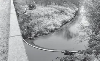  ?? Kyle Bauer/associated Press ?? A remediatio­n crew deploys a boom on Mill Creek in northeaste­rn Kansas’ Washington County after the Keystone pipeline ruptured. Also, an emergency dam was constructe­d on the creek.