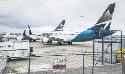  ?? JEFF MCINTOSH THE CANADIAN PRESS FILE PHOTO ?? Calgary’s WestJet Airlines Ltd. bought an optional Max safety feature it believes to be mission-critical, David Olive writes.