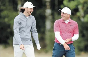  ?? ASSOCIATED PRESS FILE PHOTO ?? Tommy Fleetwood, left, and Francesco Molinari chat during day two of the British Masters at Walton Heath Golf Club in Surrey, England, on Oct. 12.