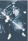  ?? CHRIS SCHWARZ MACLEAN’S ?? Ismail rides Candy’s back backstage during the Grey Cup Parade ceremonies at Nathan Phillips Square on Nov. 26, 1991.