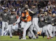  ?? MATT SLOCUM — THE ASSOCIATED PRESS FILE ?? In this file photo, the Houston Astros celebrate after Game 7 of baseball’s World Series against the Los Angeles Dodgers in Los Angeles. The Astros winning their first World Series was one of the biggest sports stories in 2017 for the AP.