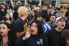  ?? AP PHOTO/JOSH EDELSON ?? Protesters shout before a speaking engagement by Ben Shapiro on the campus of the University of California Berkeley in Berkeley on Thursday. Several streets around the University of California, Berkeley, were closed off Thursday with concrete and...