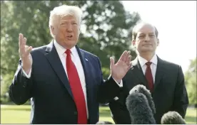  ?? AP photo ?? President Donald Trump speaks to members of the media with Secretary of Labor Alex Acosta on the South Lawn of the White House on Friday before Trump boarded Marine One for a short trip to Andrews Air Force Base, Md., and then went on to Wisconsin.