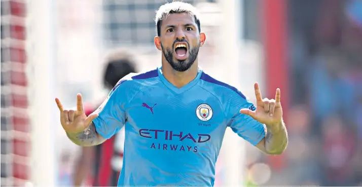  ??  ?? Icing on the cake: Sergio Aguero celebrates his second and Manchester City’s third goal against Bournemout­h and later compliment­ed his team-mate David Silva for his role as a provider of chances