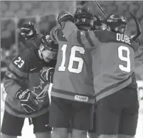  ?? NATHAN DENETTE, THE CANADIAN PRESS ?? Canada forward Sam Steel (23) celebrates his goal against the Czech Republic with teammates in the first period in Buffalo on Thursday night. Canada won, 7-2, and meets Sweden in the final on Friday night. JOHN CHIDLEY-HILL