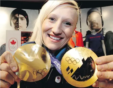  ?? DAVID BLOOM/FILES ?? Kaillie Humphries shows off her two Olympic gold medals, won in Vancouver in 2010 and Sochi in 2014. She says she may extend her career if Calgary lands the 2026 Games. She would be 40 at that point, but says in her sport, she could still compete.