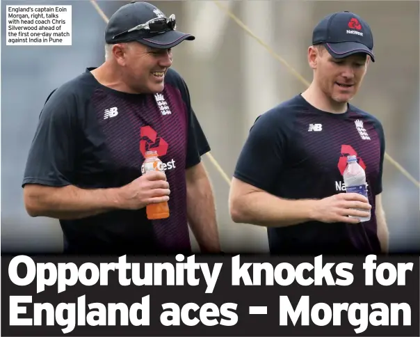  ??  ?? England’s captain Eoin Morgan, right, talks with head coach Chris Silverwood ahead of the first one-day match against India in Pune