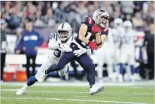  ?? MADDIE MEYER GETTY IMAGES ?? George Odum of the Indianapol­is Colts tries to tackle Julian Edelman of the Pats on Thursday. It was Edelman’s first game in more than a year.