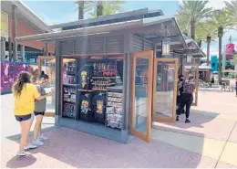 ?? DEWAYNE BEVIL/ORLANDO SENTINEL ?? Although the 2020 edition of Halloween Horror Nights has been canceled, Universal is selling HHN merchandis­e in multiple locations, including kiosks at Universal CityWalk.