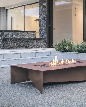  ?? DAVID CUTLER ?? Canadian company Paloform makes ultra-modern firepits from concrete, Corten, aluminum and stainless steel. Paloform’s creative director Khai Foo says they allow outdoor entertaini­ng in shoulder seasons.