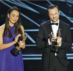  ??  ?? Joanna Natasegara and Orlando von Einsiedel receiving their Oscars in 2017