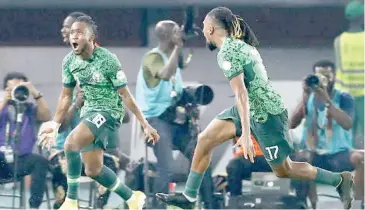  ?? ?? Super Eagles stars, Ademola Lookman and Alex Iwobi in estatic mood during a game at the 2023 Africa Cup of Nations in Cote d’Ivoire