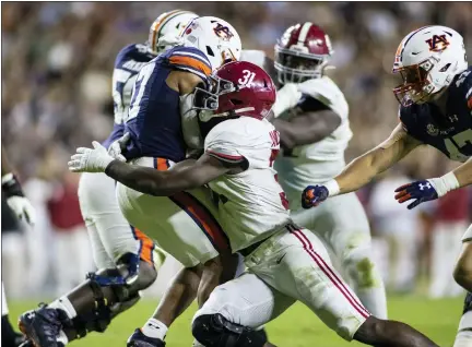  ?? ASSOCIATED PRESS FILE PHOTOS ?? Alabama linebacker Will Anderson Jr. (31) stops Auburn wide receiver Elijah Canion (17) during the second half, Nov. 27, in Auburn, Ala.