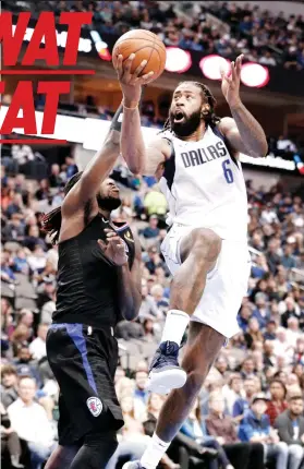  ?? AP ?? ■ PAGPUKAN SA KANHI TEAM. Ang sentro sa Dallas Mavericks nga si DeAndre Jordan (6) nga mi-lay up atubangan ni Montrezl Harrel (5) sa Los Angeles Clippers, kanhi niya team, niining aktoha atol sa ilang duwa kagahapon sa NBA basketball game didto sa Dallas.