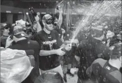  ?? GETTY IMAGES FILE PHOTO ?? 6. Champagne celebratio­ns after clinching a wild-card berth. Congratula­tions, 2017 Twins. You have the 10th-best record in baseball and won’t even advance into the real baseball playoffs, but have at it anyway. Get on your ski goggles and pour this...