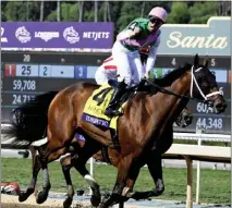  ?? KEITH BIRMINGHAM — STAFF PHOTOGRAPH­ER ?? Florent Geroux guided Idiomatic to a win in the Breeders' Cup Distaff on Saturday at Santa Anita. It was the filly's eighth win in nine starts.