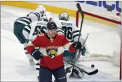  ?? ?? Panthers center Sam Reinhart (13) celebrates after scoring during the second period against the Sharks on Thursday in Sunrise, Fla.