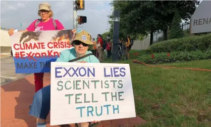  ??  ?? Blanca Gonzales, left, and Susan Cooper protest ExxonMobil’s climate change policies in Dallas. Photograph: Staff/Reuters