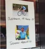  ??  ?? Below: A shop front displays photos of the Eagle of Filotranno, including his Stage 1 win at Tirreno-adriatico a week before his deathBotto­m: Riders pass through the sleepy town of Maiolati Spontini ahead of the first feed zone at 40km