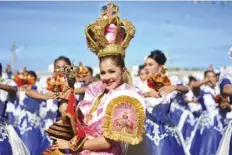  ?? ?? Sinulog Festival Queen 2024 4th runner-up Frenchie Monina performed with the Inayawan Talents Guild of Barangay Inayawan during the Sinulog Grand Parade 2024