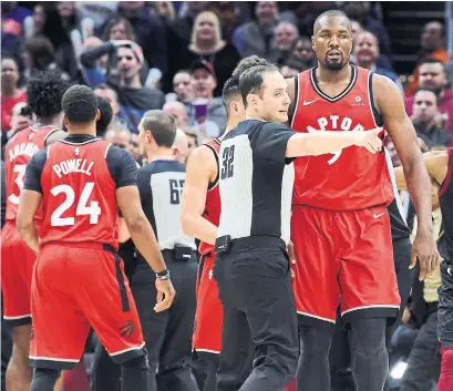  ?? JASON MILLER GETTY IMAGES ?? Raptor Serge Ibaka fought with Cavalier Marquese Chriss in the third quarter on Monday. Both were ejected from the game.