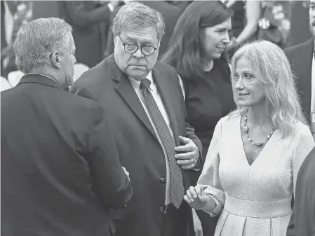  ?? CHIP SOMODEVILL­A/ GETTY IMAGES ?? White House Chief of Staff Mark Meadows, Attorney General William Barr and former presidenti­al aide Kellyanne Conway gather in the Rose Garden on Sept. 26 for President Trump’s Supreme Court nomination event.