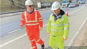  ?? ?? ● Mike Amesbury MP, right, joined a National Highways litter pick on the M56 at junction 12, Clifton, Runcorn.