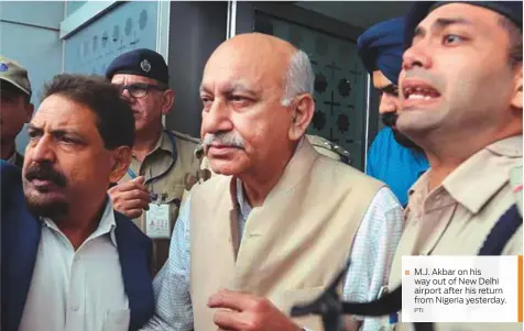  ?? PTI ?? M.J. Akbar on his ■ way out of New Delhi airport after his return from Nigeria yesterday.