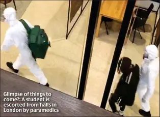  ??  ?? Glimpse of things to come?: A student is escorted from halls in London by paramedics