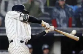  ?? KATHY WILLENS - THE ASSOCIATED PRESS ?? New York Yankees’ Didi Gregorius hits a seventh-inning, three-run home run in a baseball game against the Tampa Bay Rays at Yankee Stadium in New York, Tuesday, April 3, 2018.