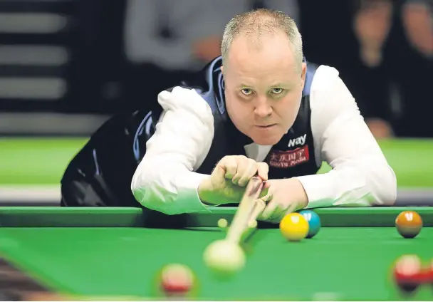  ??  ?? PRECISION PLAY: John Higgins in action at the Barbican where he overcame the challenge of Chinese teenager Yan Bingtao