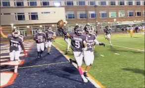  ?? Scott Ericson / Hearst Connecticu­t Media ?? McMahon’s Adrian Vega celebrates his winning touchdown in overtime against Westhill on Friday.