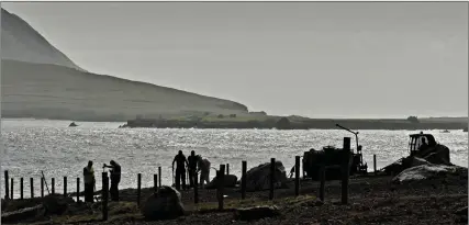  ??  ?? Contractor­s Pat Ashe & Co. laying the new path to the OPW’s soon to be completed viewing platform at the Blasket Centre.