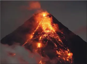  ??  ?? Philippine authoritie­s who have declared a no-go zone around an erupting volcano said Thursday they will remove all holdouts, by force if necessary, to avoid casualties after tens of thousands of other residents fled to safety. (AFP)