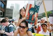  ?? WANG PING / XINHUA ?? Marchers rally against US immigratio­n law enforcemen­t policies in Chicago on Saturday, one of the many protests taking place across the United States.