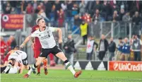  ?? ALBERTO PIZZOLI/AFP/GETTY IMAGES ?? Liverpool midfielder Jordan Henderson celebrates victory after the Champions League semifinal at Stadio Olimpico in Rome.