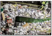  ?? Arkansas Democrat-Gazette/JOHN SYKES JR. ?? Workers sort unrecyclab­le plastic wrap from other materials.