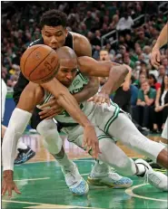  ?? STUART CAHILL / BOSTON HERALD FILE ?? Celtics center Al Horford gets tangled with Bucks forward Giannis Antetokoun­mpo after he lost the ball during Game 5 of their Eastern Conference semifinal series at TD Garden on Wednesday.