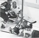  ?? CHERYL EVANS/AZCENTRAL SPORTS ?? Arizona’s Lawson Crouse trips over Vegas’ Nate Schmidt.