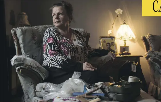  ?? PHOTOS: TYLER ANDERSON / NATIONAL POST ?? Tina Martino sits with some of her son’s belongings at her home in Niagara Falls, Ont. Nazzareno Tassone, 23, was killed a few days before Christmas while he was fighting with the Kurdish forces against ISIL in Syria. She was told his body was not...