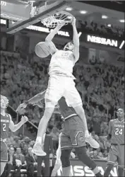  ?? Andy Lyons Getty Images ?? JOHN FULKERSON dunks against South Carolina as Tennessee won its 23rd straight home game.