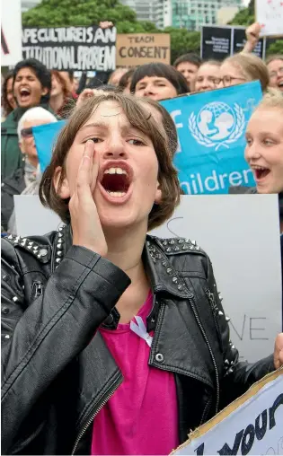  ?? PHOTO: ROSS GIBLIN\FAIRFAX NZ ?? Norma McLean, 14, of Wellington High School, joins hundreds of demonstrat­ors at a protest at Parliament yesterday against rape culture in secondary schools.