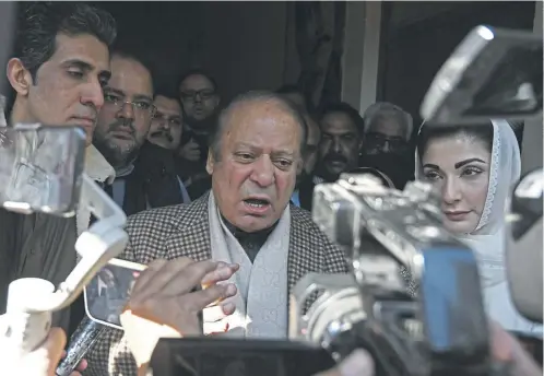  ?? ?? Pakistan’s former prime minister Nawaz Sharif speaks to media after casting his vote, while archrival Imran Khan, below, remains in jail