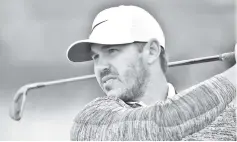  ??  ?? Koepka watches his shot from the 17th tee during a practice round at The 147th Open golf Championsh­ip at Carnoustie, Scotland. — AFP photo