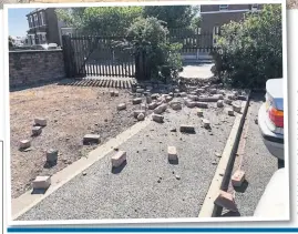  ??  ?? The smashed front wall of Linwar Motors in Virginia Street, above, and, left, bricks narrowly missed cars