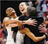  ?? AJ Mast/Associated Press ?? UConn’s Morgan Tuck, left rear, Moriah Jefferson, front left, and Breanna Stewart hug coach Geno Auriemma after winning the 2016 national championsh­ip in Indianapol­is.