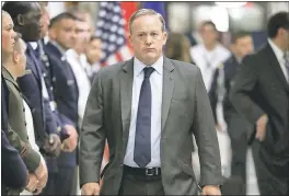  ?? PABLO MARTINEZ MONSIVAIS — THE ASSOCIATED PRESS ?? White House press secretary Sean Spicer walks down the hallway during President Donald Trump’s visit to the Pentagon, on Thursday. Spicer resigned on Friday.