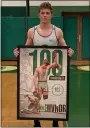  ?? SUBMITTED ?? Cole Hivnor, a senior at Lake Catholic, holds a commemorat­ive photo honoring his 100th career pin.