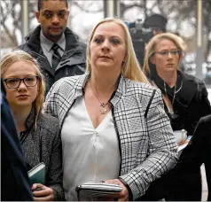  ?? GETTY IMAGES ?? Family members of former Chicago police officer Jason Van Dyke, including his wife, Tiffany, arrive at the Leighton Criminal Courts Building for his sentencing in the 2014 murder of 17-year-old Laquan McDonald.